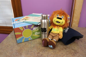 photo of louie lionheart® and other items that go in welcome box