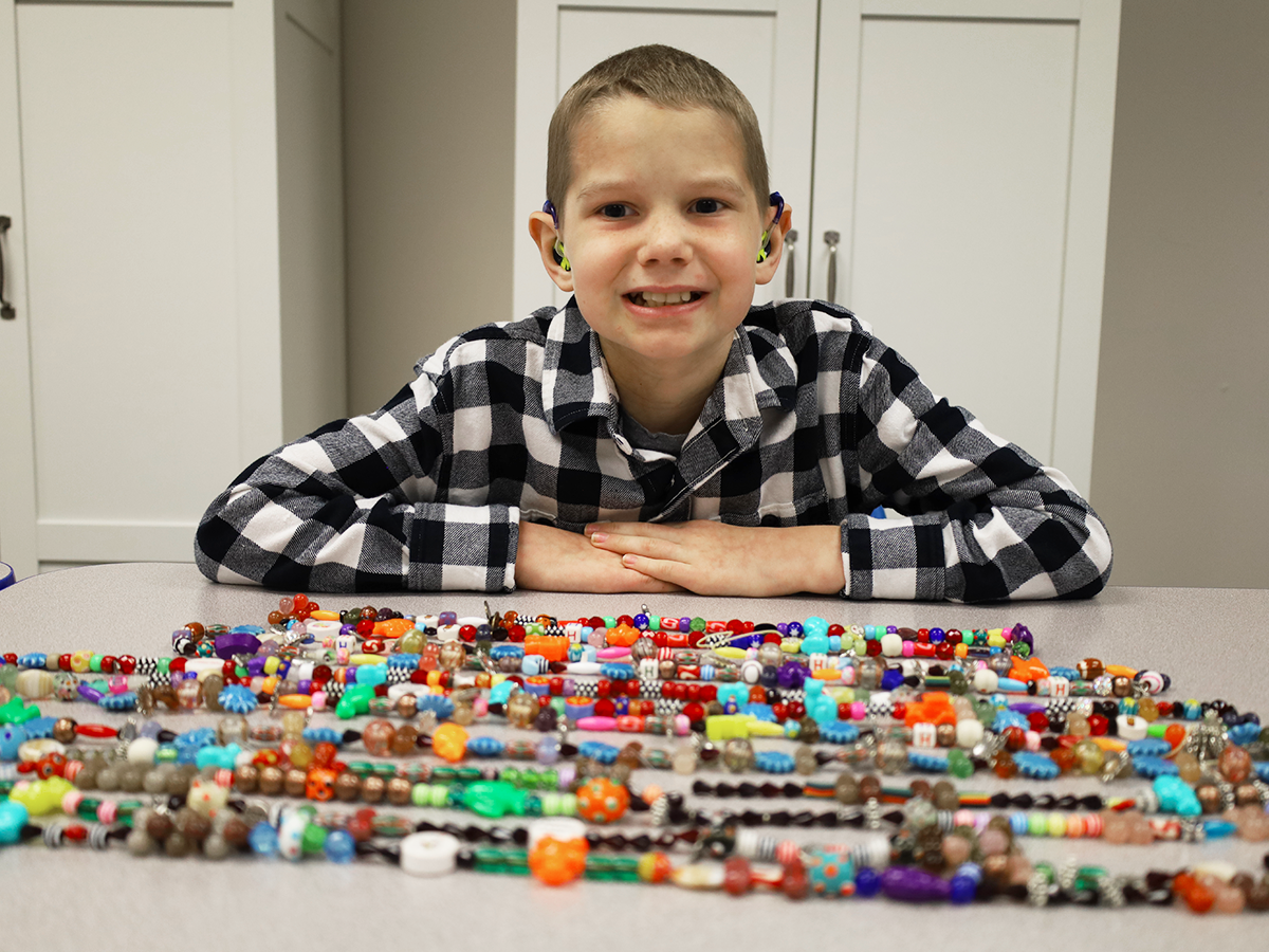 boy with beads4bravery strands