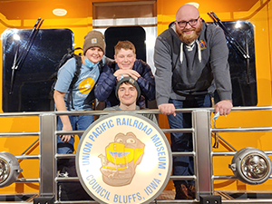 photo of teens and volunteer at union pacific museum